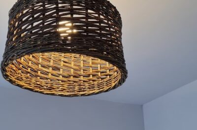 A lampshade made from willow on a weaving course