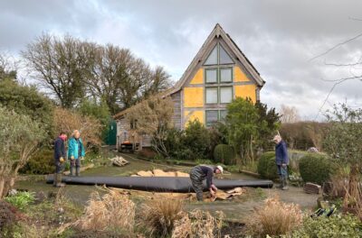 Volunteers installing new pond liner